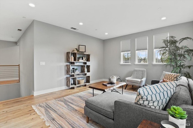 living room with light hardwood / wood-style flooring