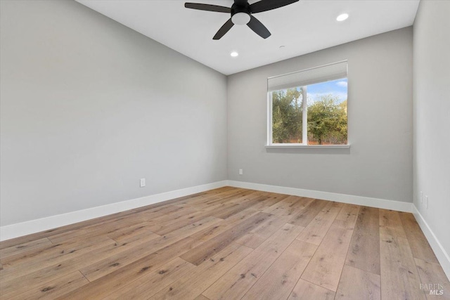 spare room with ceiling fan and light hardwood / wood-style flooring