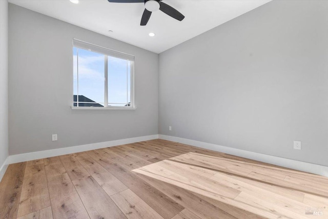 spare room featuring ceiling fan and light wood-type flooring