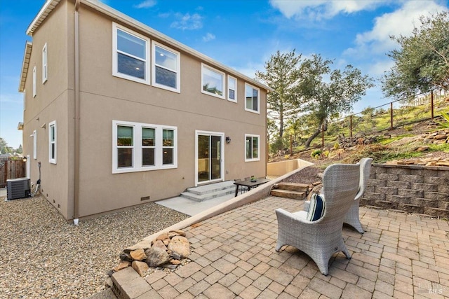 back of property with a patio and central air condition unit