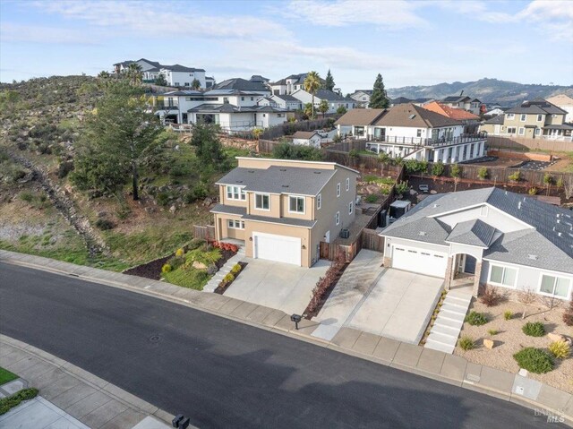 birds eye view of property with a mountain view