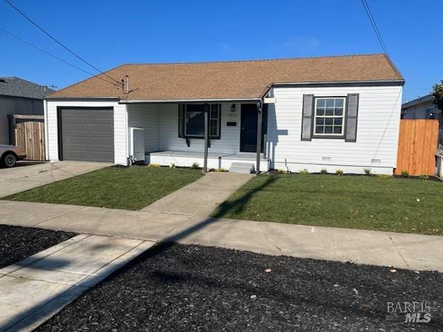 ranch-style home with a front yard, a garage, covered porch, and fence