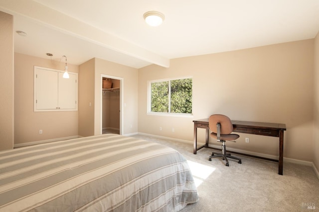 bedroom with vaulted ceiling with beams and carpet