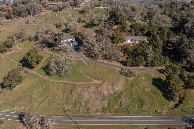 back of property with a wooden deck and a yard