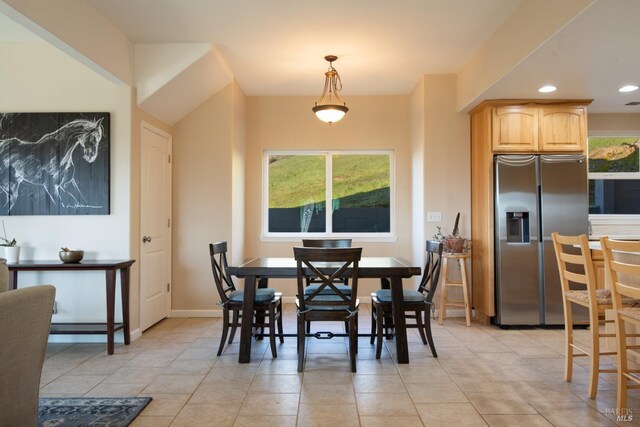 dining area featuring light tile patterned floors