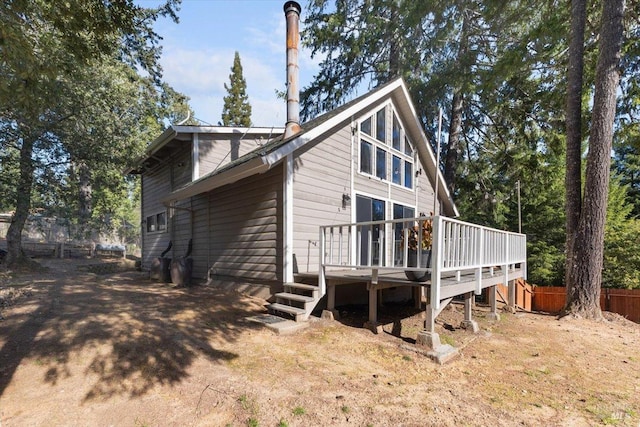 back of property featuring a deck