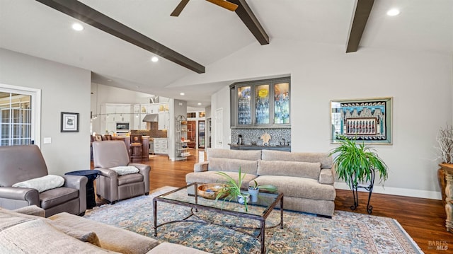 living room with wood-type flooring, vaulted ceiling with beams, and ceiling fan