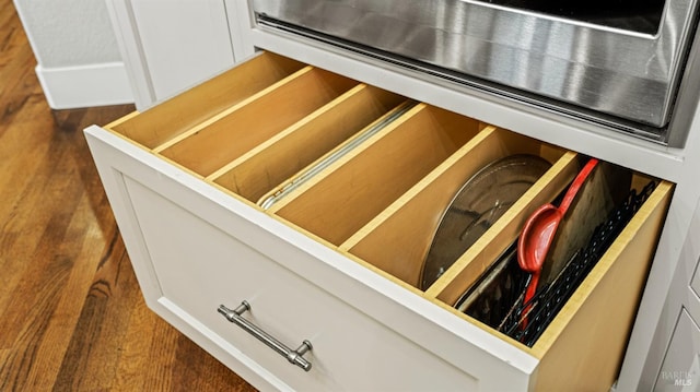 interior details featuring white cabinetry