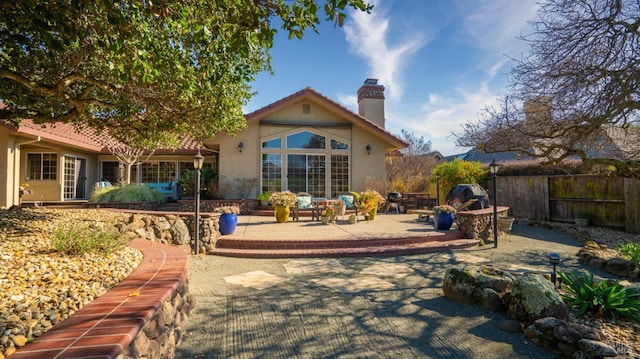 rear view of house with a patio area