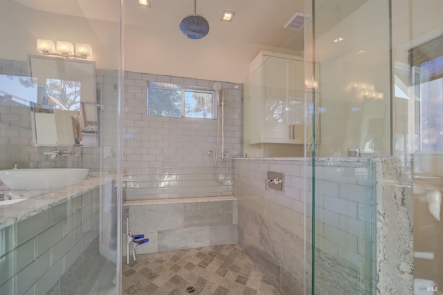 bathroom with a shower with shower door