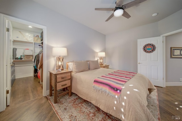 bedroom featuring a closet, ceiling fan, and dark wood-type flooring