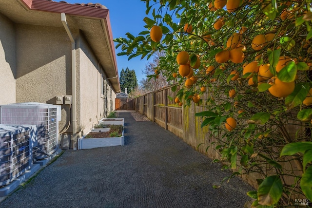 view of side of property featuring central AC unit