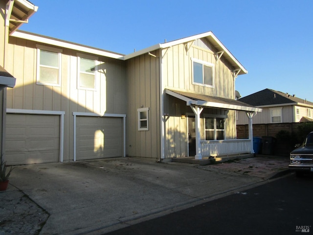 view of front of home with a garage and a porch