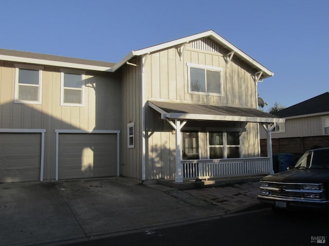 view of front facade with covered porch and a garage