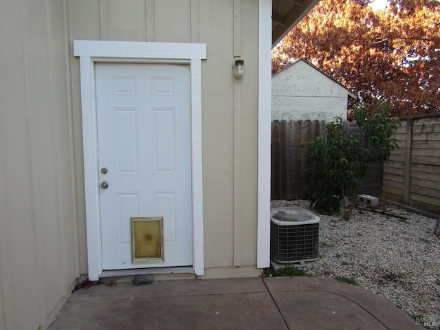 entrance to property featuring central AC unit