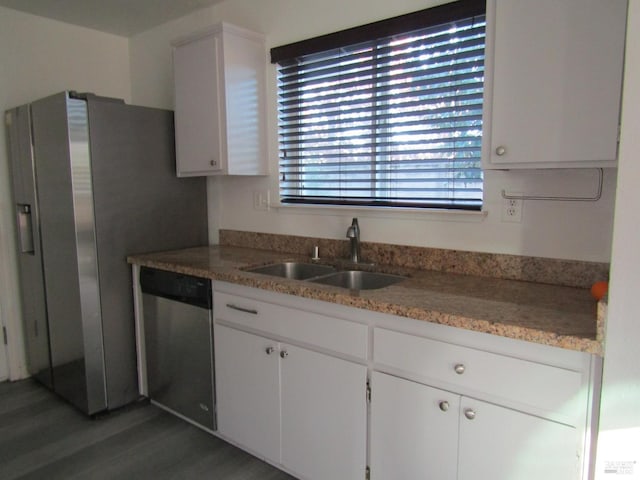 kitchen with sink, white cabinetry, dark hardwood / wood-style floors, and dishwasher