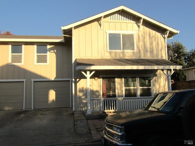 view of front facade with a garage and a porch