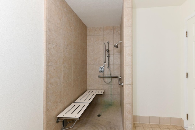 bathroom featuring a tile shower and tile patterned floors