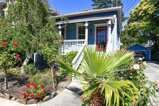 view of front of house with an outbuilding and covered porch