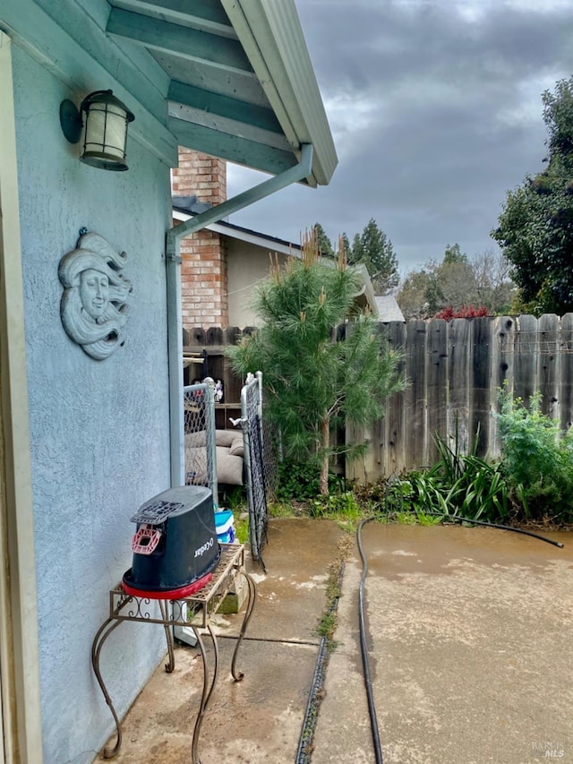 view of patio / terrace with fence