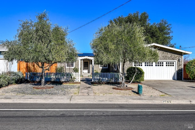 obstructed view of property with a garage