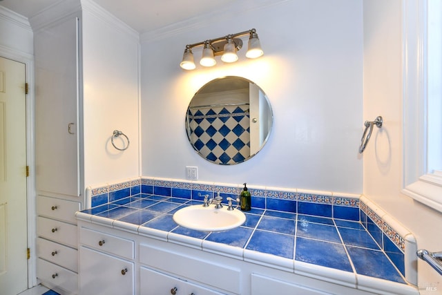 bathroom featuring vanity and ornamental molding