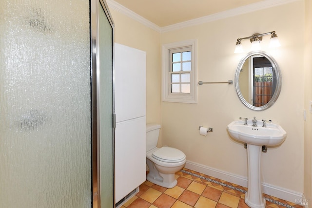 bathroom with toilet, ornamental molding, and tile patterned floors