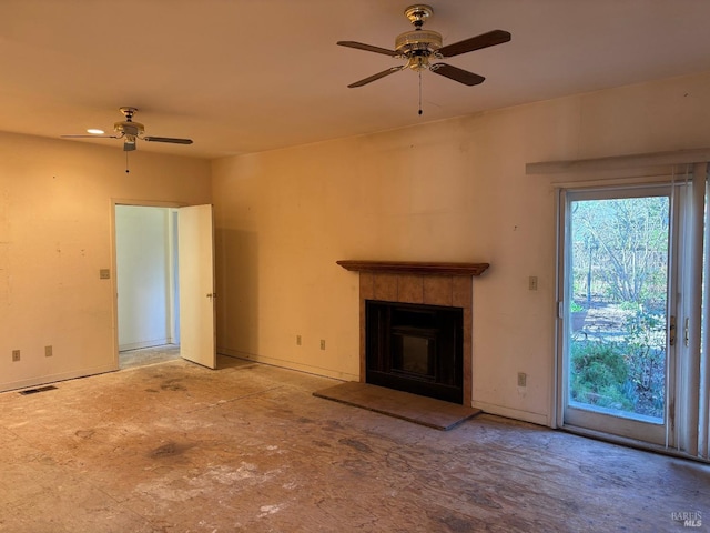 unfurnished living room with ceiling fan