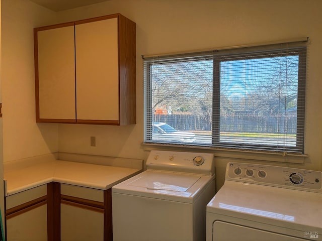 laundry room with cabinets and independent washer and dryer