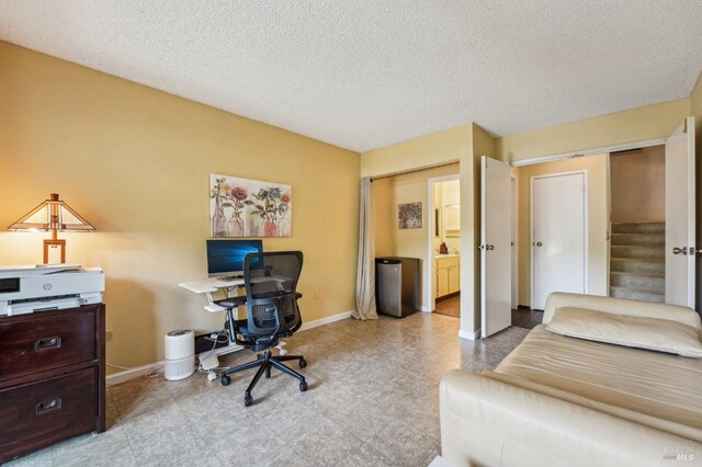 home office with a textured ceiling