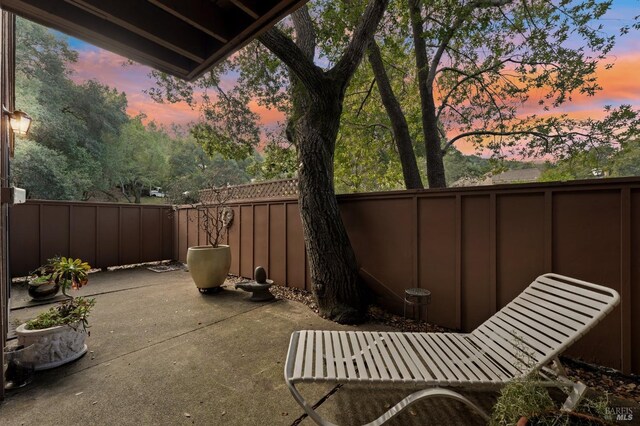 view of patio terrace at dusk