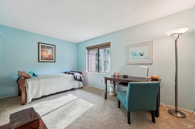 carpeted bedroom with a textured ceiling