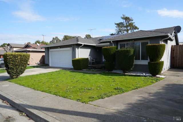 ranch-style home with a garage and a front lawn