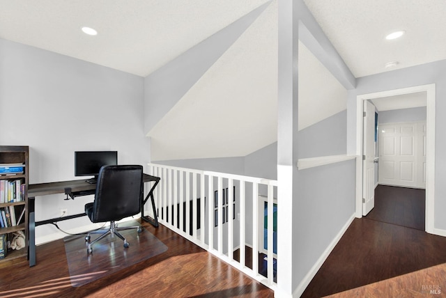 office space with lofted ceiling and dark hardwood / wood-style floors