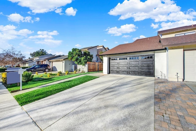 view of home's exterior with a garage and a yard