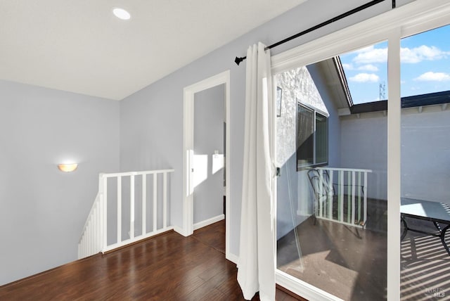 interior space featuring lofted ceiling and wood-type flooring