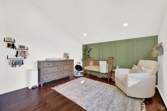 sitting room featuring lofted ceiling and dark wood-type flooring