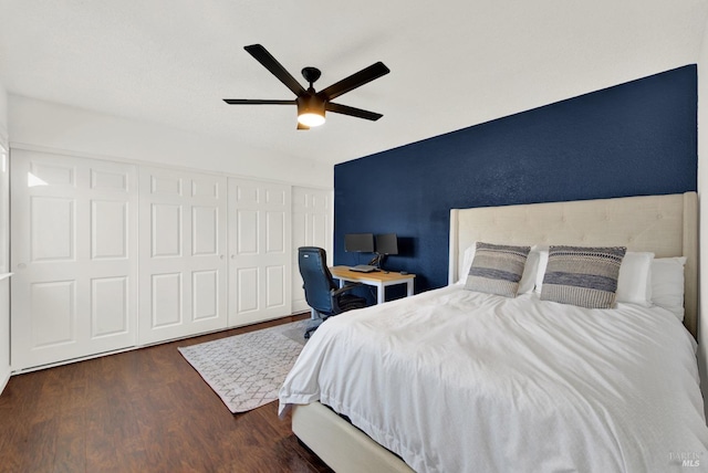 bedroom with ceiling fan, dark hardwood / wood-style flooring, and a closet