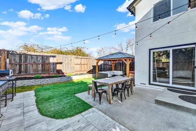 view of patio with an outdoor living space and a gazebo