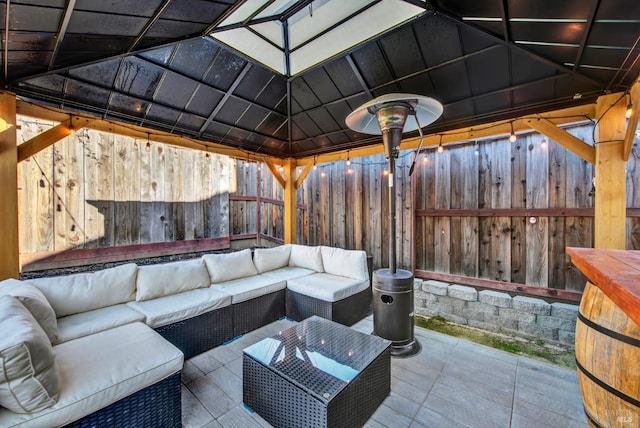 view of patio with an outdoor hangout area and a gazebo