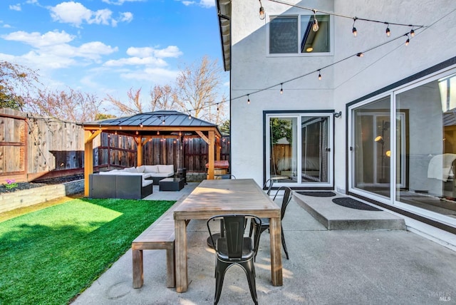 view of patio / terrace with an outdoor living space and a gazebo