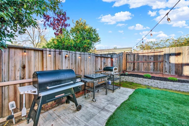 view of patio featuring a grill