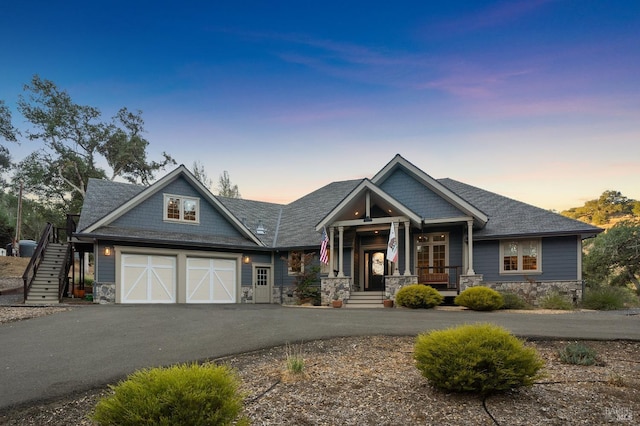 craftsman house with a garage