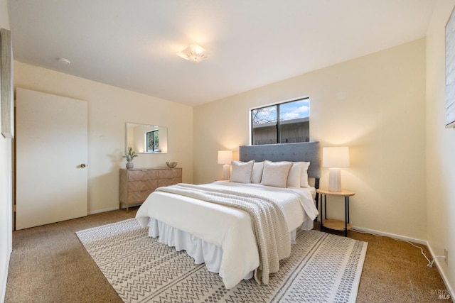 bedroom featuring light carpet