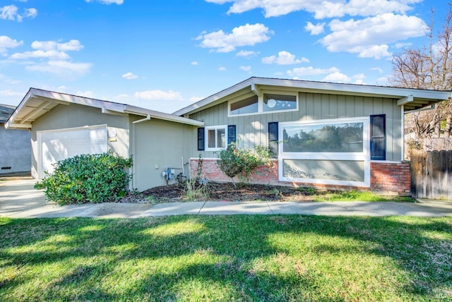 view of front of house with a garage and a front yard