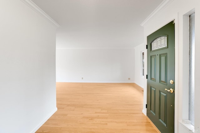 entryway featuring ornamental molding and light wood-type flooring