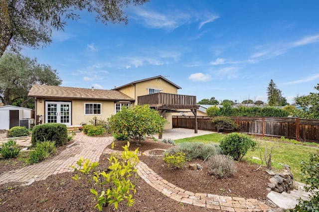 rear view of house with a patio