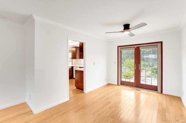 unfurnished room with crown molding and light hardwood / wood-style floors