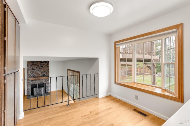 living room featuring a wealth of natural light and light wood-type flooring