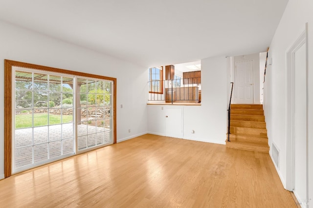 unfurnished living room with light wood-type flooring